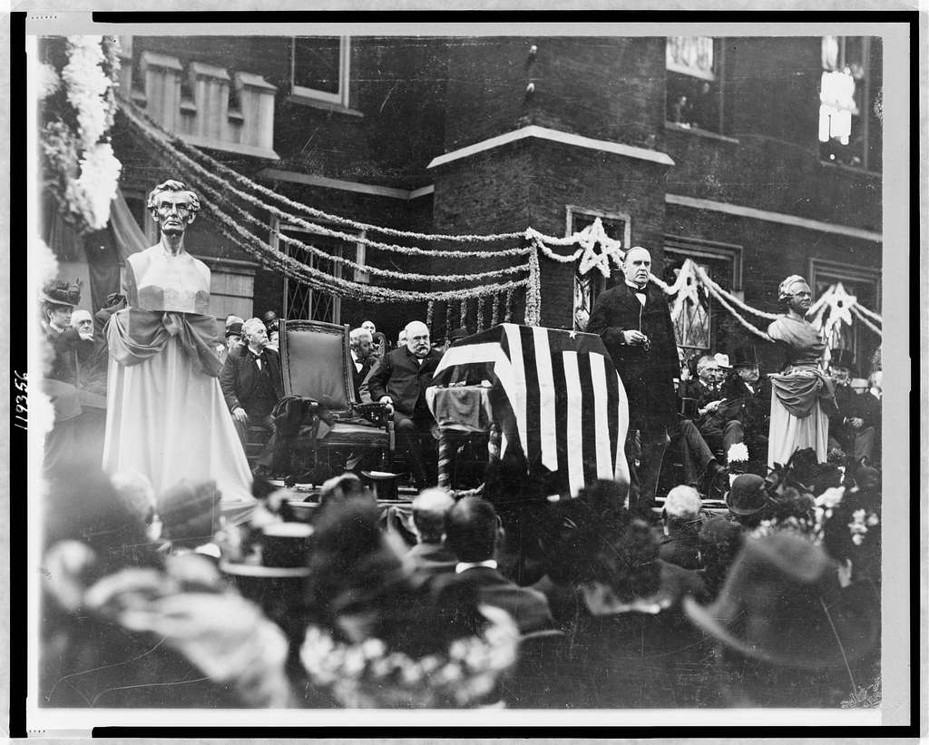 McKinley speaking on steps in front of audience, Galesburg, Illinois.